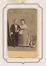 From the Fairy Wedding Album: Charles S. Stratton and M. Lavinia Warren, older, standing arm in arm (version 2)