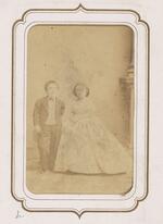 From the Fairy Wedding Album: Charles S. Stratton and M. Lavinia Warren standing together, arms apart from each other