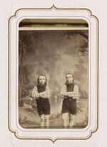 From the Fairy Wedding Album: Hiram W. and Barney Davis (the Wild Men of Borneo) standing with their arms folded