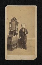 Photograph: George Washington Morrison (Commodore Nutt) standing beside a chair (owned by the Bridgeport History Center)