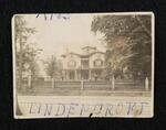 Photograph: Lindencroft from a distance with visible fence