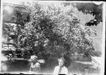 022 Mother and Hattie in yard with book