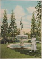 Woman Holding Flowers In Front Of Fountain, Branford