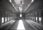Interior view of a New Haven Railroad passenger car, possibly a parlor car (carpeted but no seats)