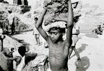 Bonded (slave) Child Laborer Carries Clay To Be Made Into Bricks