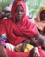 woman holds her baby at the Oure Cassoni refugee camp in Chad