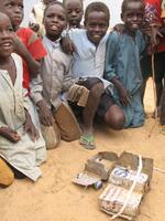 Children with homemade toys at a refugee camp in the Central African Republic run by the International Rescue Committee