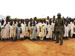 Darfuri boys with an African Union peacekeeping soldier
