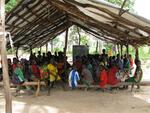 Darfuri children attend class at a bush school