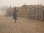 woman walking as a sandstorm approaches