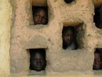 Children in the Central African Republic peek out of a window of a school along the border with Chad