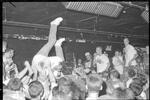 Teenager stage diving into audience