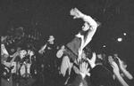Stage diving teenager in action
