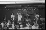 Teenage band performing on stage