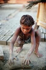 Bonded (Slave) Boy Makes Bricks At A Kiln In India