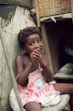 Young Girl Eats Lunch At The Dump