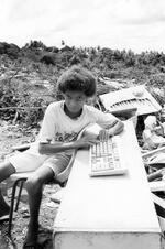 Boy Plays With Keyboard At The Dump