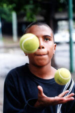 Boy Juggles Balls On The Street For Money
