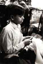 Boy Sews Fabric