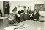 Children listening to a Montessori teacher, the Whitby School