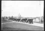 Automobiles at Storrs lined up in front of Main Building, Storrs Congregational Church and Whitney Hall in background