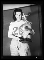 Unidentified woman with football trophy