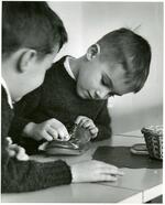 Young Boy Shining a Shoe a Whitby School