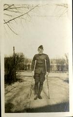 Philip McCook with crutches after being wounded in France. 