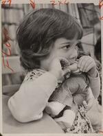 Child with doll, December 27, 1973