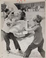 Boys engaged in pillow fight, Glastonbury, May 18, 1974