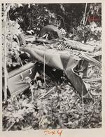 Chassis and front wheels of car after accident, June 13, 1964 