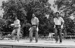 Three young men dance in a line at Peace Train's Breaking & Popping Contest, Bushnell Park