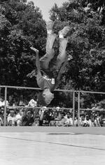 Boy upside down in air at Peace Train's Breaking & Popping Contest, Bushnell Park
