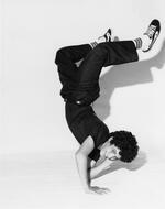 Raymond Mojica of the Wildstyle Breakers freezes in an elbow stand
