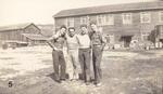 (L-R): unknown, unknown, Ralph Sabia, William Gimignani. Standing in front of barracks where they were housed. Sasebo, Japan. 1945.