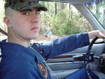 Beaufort, SC � MCAS Beaufort; LCPL Joseph O�Keefe; driving to work wearing coveralls; 4/2004