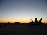 Al Asad, Iraq; Sunrise with F/A-18D in foreground; 1/2005