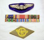 (Top to bottom): Army Air Corps Pilot�s Wings, Overseas ribbons (L-R top row: Air Medal x 3, Good Conduct, European-African-Middle Eastern Campaign Medal x 3. (L-R bottom row: European-African-Middle Eastern Campaign Medal x 3, American Campaign Medal,