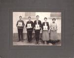 Postcard of Elsie Lathrop (teacher) and her school children at the Black Hill Schoolhouse