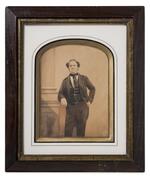 Photograph: "P.T. Barnum with arm resting on base of column"