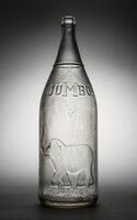 Physical object: Glass bottle featuring Jumbo