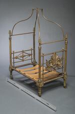 Furniture: Miniature canopy bed belonging to Charles S. Stratton with ruler for scale