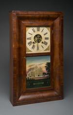 Physical object: Rectangular mantel clock with glass panel featuring Barnum's Iranistan home