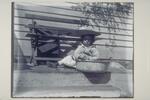 Isabel Grinnell of Mystic sitting on the steps of a house