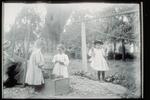 Ada Newbury of Mystic and two other girls playing in a yard