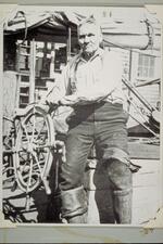 Captain "Zeb" Tilton at the wheel of coasting schooner Alice S. Wentworth
