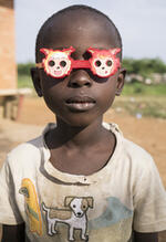 Boy With Sunglasses Posing For Portrait