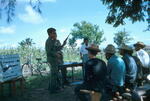 Instructing Village men to use M-1 Rifle