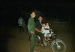 Dad with two children on motor bike